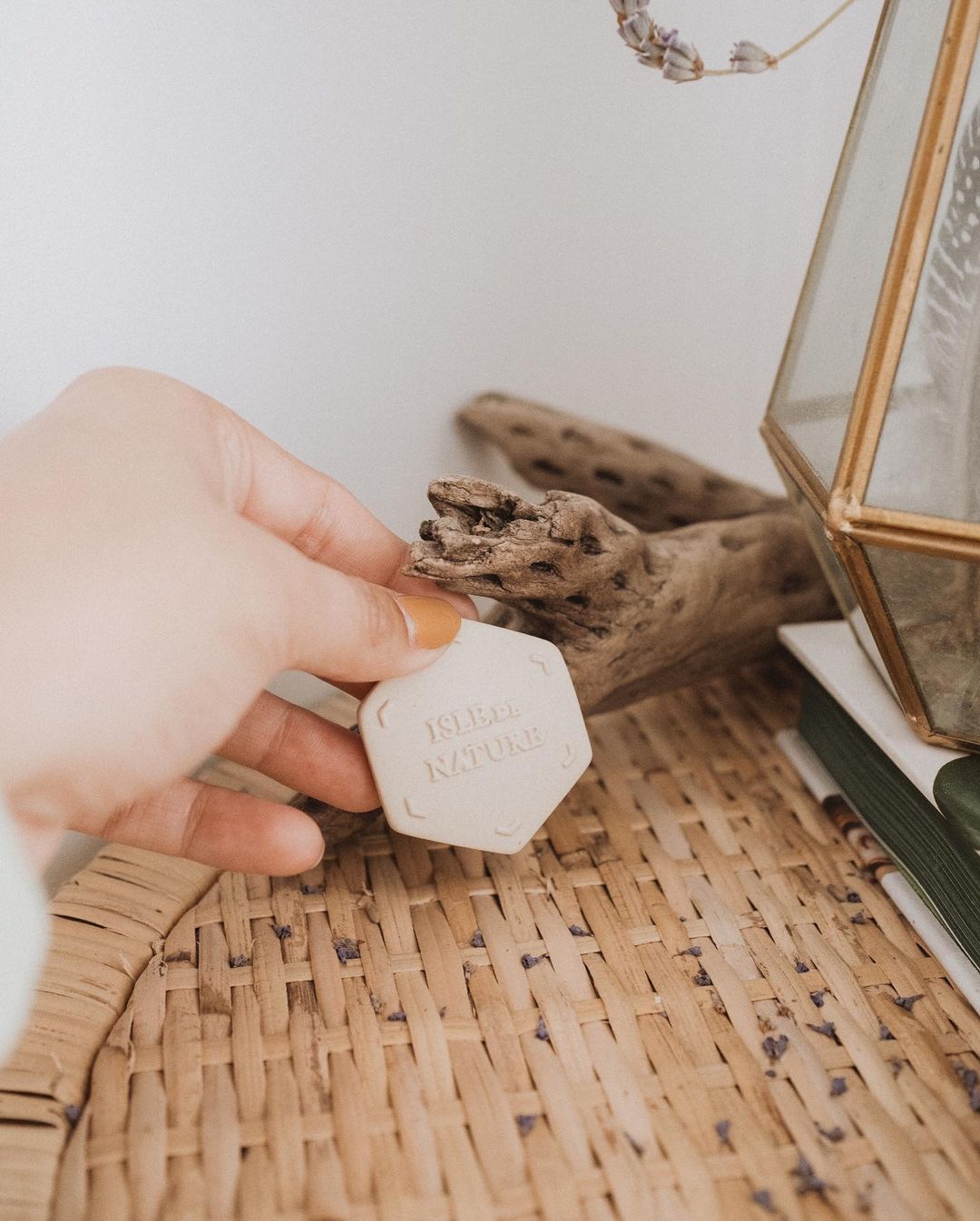 Photo of woman with coral nail polish Scent Coin air freshener